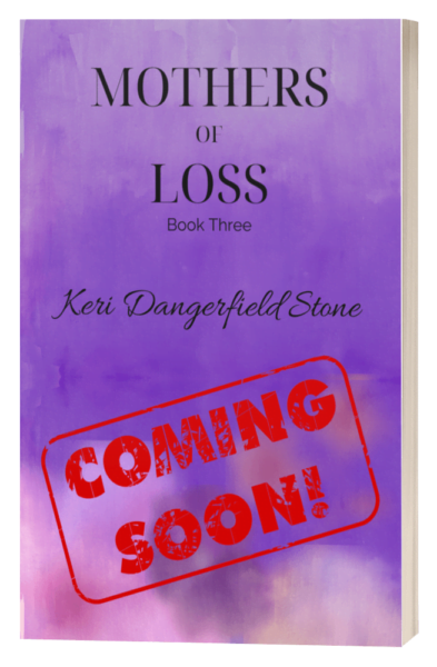 Links to more info about Book 3, Mothers of Loss. Image of Upcoming book cover for 'Mothers of Loss' by Keri Dangerfield Stone, marked with a 'COMING SOON' stamp over a purple watercolor background.