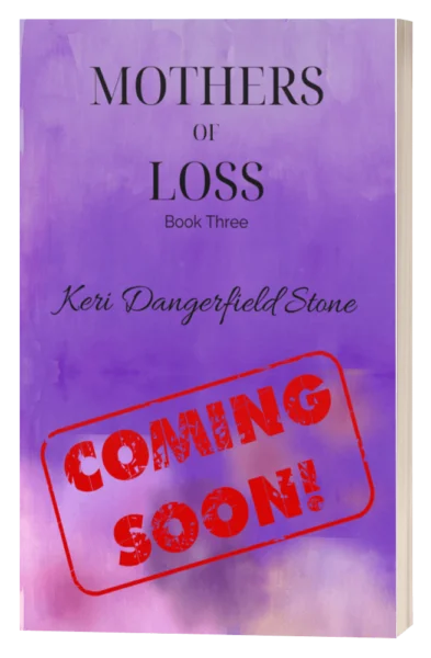 Links to more info about Book 3, Mothers of Loss. Image of Upcoming book cover for 'Mothers of Loss' by Keri Dangerfield Stone, marked with a 'COMING SOON' stamp over a purple watercolor background.